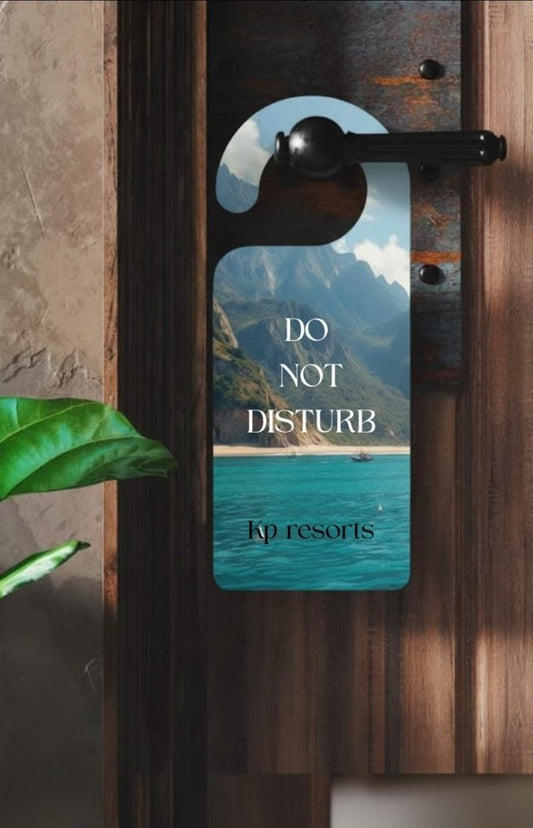 Door hanger with scenic design and 'Do Not Disturb' text on a wooden door.