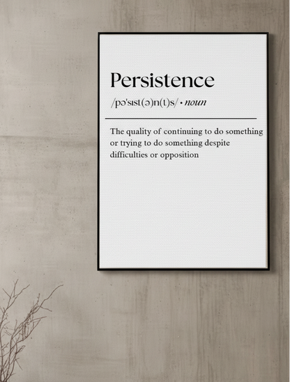 Framed poster with the word 'Persistence' and its definition on a wooden wall.