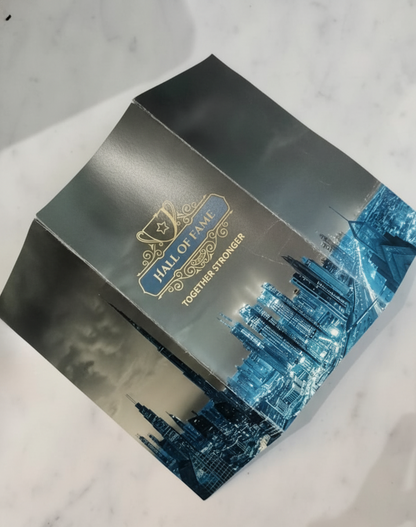 Product packaging with a cityscape design and 'Hall of Fame' branding on a marble surface.