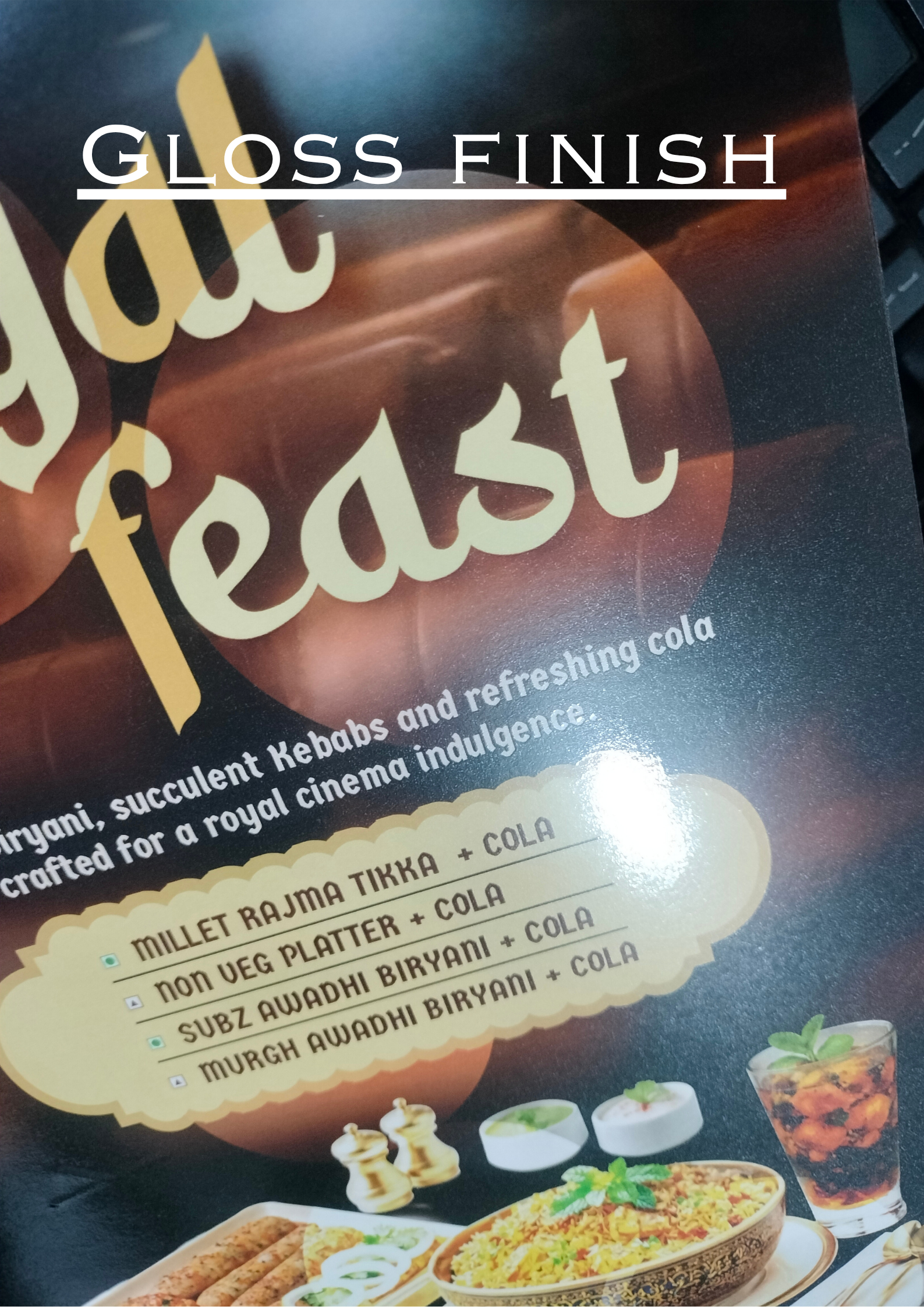 Product packaging with 'Royal Feast' branding and food images on a glossy surface.