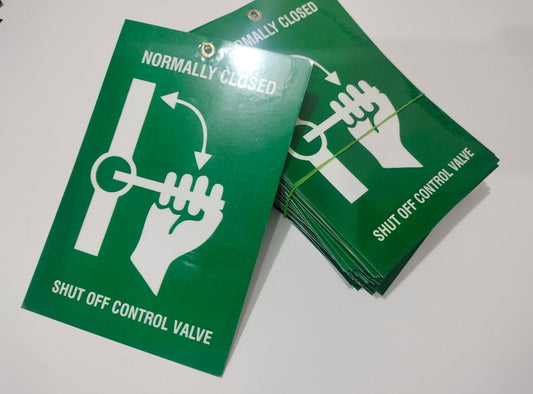 Green signs with white symbols and text on a white background