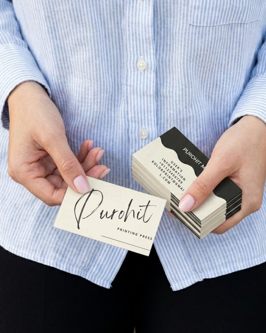 Person holding a stack of business cards with 'Purchit' branding.